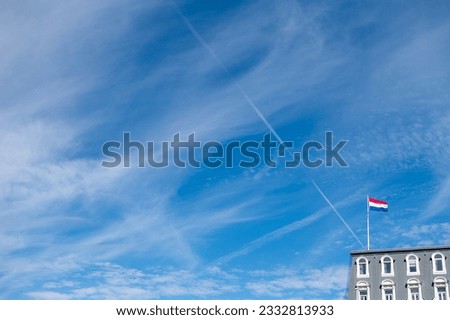 Flag of the Netherlands seen on top of a building