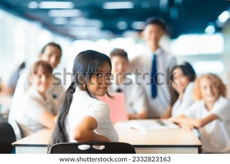 Kids go back to school. Interracial group of children of mixed age on the first day of new academic year. Teenager in classroom. High and middle school students walk to lesson. Secondary student class Royalty-Free Stock Photo #2332823163