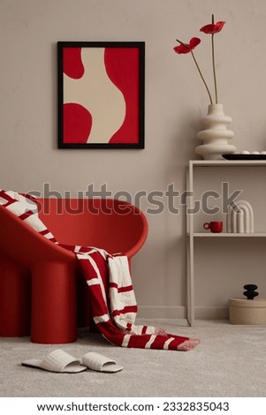Modern composition of colorful living room interior with mock up poster frame, red armchair, plaid, vase with flowers, slippers, sculpture and personal accessories. Home decor. Template. Royalty-Free Stock Photo #2332835043