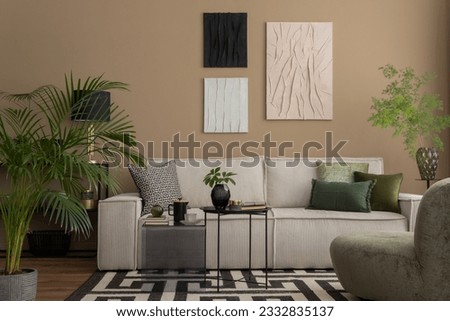 Warm and cozy living room interior with mock up poster frame, black rack, modular sofa, patterned rug, lamp, stylish sculpture, box, green armchair and personal accessories. Home decor. Template.
