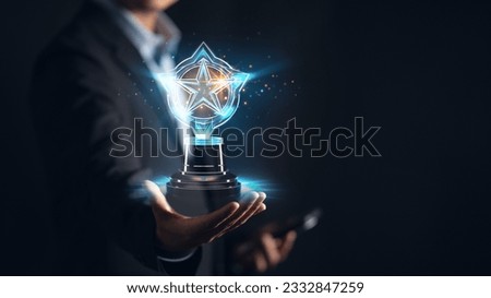 Businessman holding a guarantee trophy, symbolizing customer satisfaction and success. Trust, quality, and credibility for happy customers and positive reviews Royalty-Free Stock Photo #2332847259