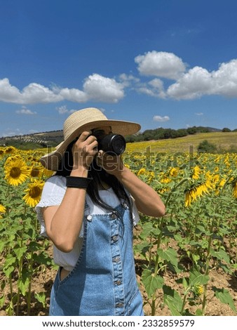 Female photographer in nature. World day photography.