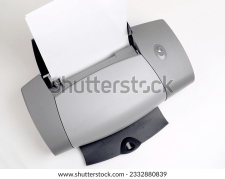
a inkjet printer with white paper.         