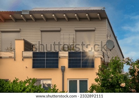 Balcony solar power station eco-friendly to use renewable energy. Solar power plant on a balcony with sunlight reflection and special lens flare light effect.