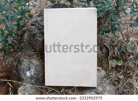 Blank cover of the book in nature mock up 