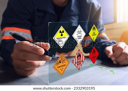 The warehouse safety officer inspects the check list of hazardous chemicals dangerous to meet safety standards before transport or distributed to industrial plants or export to foreign countries. Royalty-Free Stock Photo #2332903195