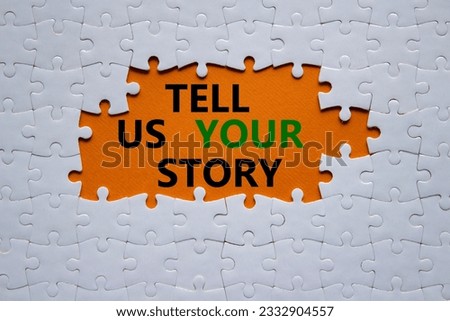 Tell us your story symbol. Concept words Tell us your story on white puzzle. Beautiful orange background. Business and Tell us your story concept. Copy space.
