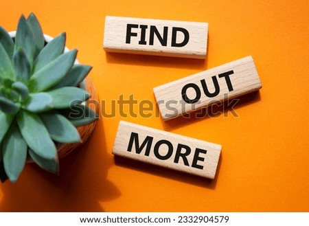 Find out more symbol. Concept word Find out more on wooden blocks. Beautiful orange background. Business and Find out more concept. Copy space Royalty-Free Stock Photo #2332904579