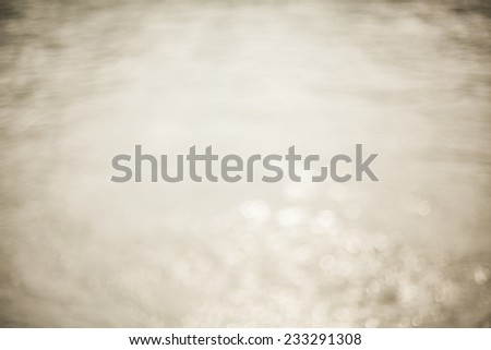 beige background of blurred water