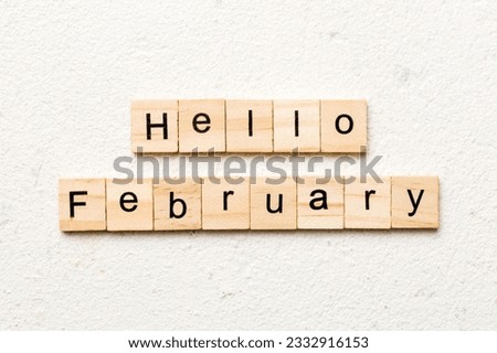 hello February word written on wood block. hello February text on table, concept.