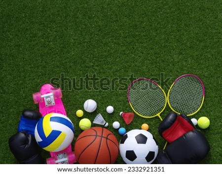 Set of sport equipment on green grass Royalty-Free Stock Photo #2332921351