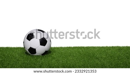 Soccer ball on green grass isolated on white
