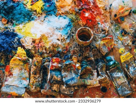 Paint tubes on colorful background