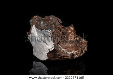 Chondrite Meteorite L Type isolated, piece of rock formed in outer space in the early stages of Solar System asteroids. This meteorite comes from a meteorite fall impacting Earth Royalty-Free Stock Photo #2332971165