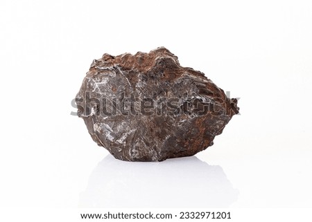 Chondrite Meteorite L Type isolated, piece of rock formed in outer space in the early stages of Solar System asteroids. This meteorite comes from a meteorite fall impacting Earth Royalty-Free Stock Photo #2332971201