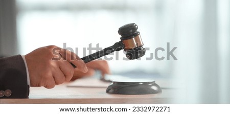 Justice concept, male judge doing report papers in courtroom Justice concept, male judge doing report papers in courtroom, fair trial, drafting new law to modern era.. Royalty-Free Stock Photo #2332972271