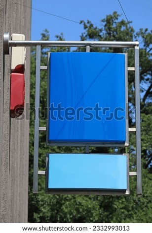 Blank plastic signs on the wall of a building