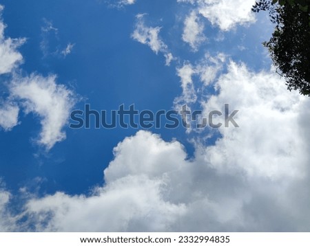 Blue sky texture under favorable weather conditions Royalty-Free Stock Photo #2332994835