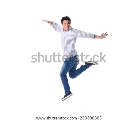 young happy man jumping Royalty-Free Stock Photo #233300305
