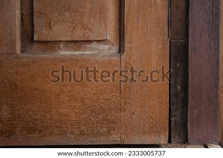 Picture of a door made of wood, this is an old door, this picture was taken at close range
