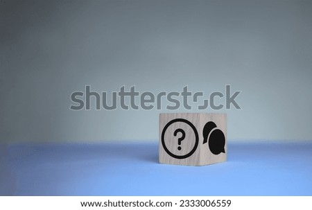 Q and A concept. Q and A symbols on wooden cube block on a grey background. Illustration for frequently asked questions concepts in websites, social networks, business issues. Recommendation concept