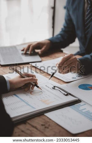 The sales department is having a monthly summary meeting to bring it to the department manager, they are verifying the correctness of the documents that are prepared before bringing in to the manager Royalty-Free Stock Photo #2333013445