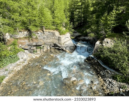 creek and mountains view, with rapid waterfalls and nature, Valle d'Aosta Italy