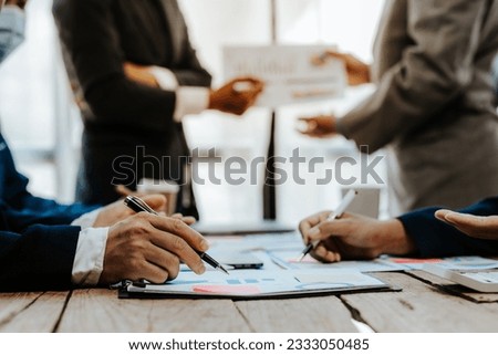 Team of business people meeting for business planning, brainstorming, accounting, tax and brokerage. Royalty-Free Stock Photo #2333050485