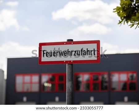 Feuerwehrzufahrt sign (fire brigade access road) in front of an industry building in Germany. Fire protection is important for architects when designing and planning buildings.
