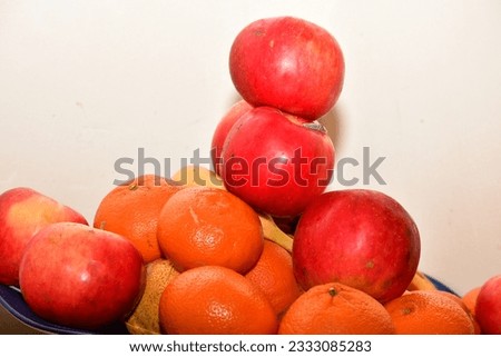 Orange is fruit of the orange, a hybrid fruit tree resulting from crossing  pomelo with tangerine.
The peel and core are orange in color, with the core being peeled and eaten raw or squeezed for juice