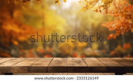 The empty rustic wooden table for product display with blur background of autumn forest. Exuberant image. Royalty-Free Stock Photo #2333126149