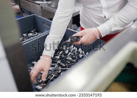 Close shot for restaurant silver cluttery, no face Royalty-Free Stock Photo #2333147193