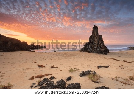 Sensational sunrise at Mullimburra Point South with Pyramid Rock, south coast NSW. Mullimburra Point is composed of resilient 400 million-year-old granite and is located in the national park