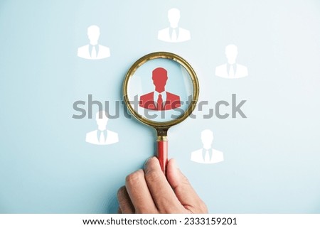 HRM vision Magnifier glass zooms in on manager icon, symbolizing the strategic role of human resource management in human development, recruitment, and leadership. employees selection Royalty-Free Stock Photo #2333159201