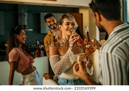 	
A group of friends engage in lively conversation, having food and drinks, sharing a joke, and laughing together.	
 Royalty-Free Stock Photo #2333169399