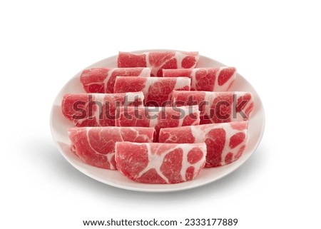 Slice of fresh raw slices Kurobuta pork with high-marbled texture on white plate isolated on white background. Royalty-Free Stock Photo #2333177889