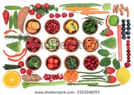 Health and super food selection for paleo diet with fruit and vegetables over white background. High in vitamins, antioxidants, minerals and anthocyanins.