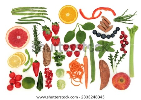 Paleolithic diet health food of fruit and vegetables over white background. High in vitamins, antioxidants, minerals and anthocyanins. Royalty-Free Stock Photo #2333248345