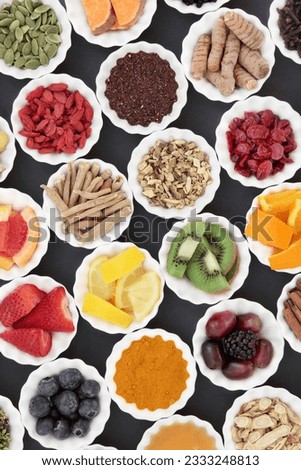 Super food and medicinal herb selection for cold and flu remedy including foods high in antioxidants and vitamin c over grey background.