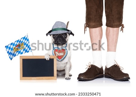 pug dog with gingerbread heart and bavarian owner ,holding a banner or blackboard placard, isolated on white background