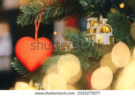 Abstract winter Christmas background with snow, fir branches and lights. Beautiful soft atmospheric natural background in pastel light colors. Xmas with tender bokeh.