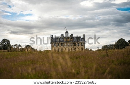 Cloudy sky over Kingston Lacy manor. Royalty-Free Stock Photo #2333276685