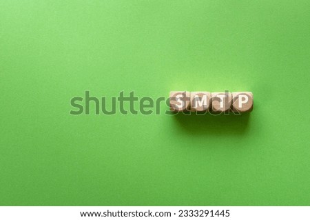 There is wood cube with the word SMTP. It is an abbreviation for Simple Mail Transfer Protocol as eye-catching image.