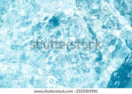 Closeup Transparent blue clear water surface texture with ripples. Abstract​ of​ surface​ blue​ splashes and bubbles​ water waves  reflected​ with​ sunlight​ for​ 
Cosmetic moisturizer micellar toner