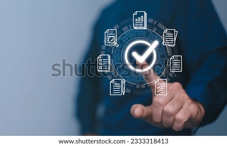 Quality management with Quality Assurance or QA and Quality Control or QC and improvement. Standardization, certification concept. Compliance to regulations and standards. Concept with manager. Royalty-Free Stock Photo #2333318413