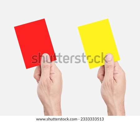 Hand hold red and yellow card isolated on white background with clipping path