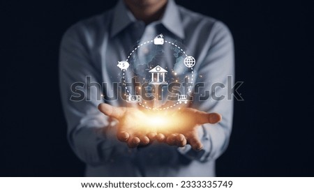 Businessman holding a hologram online banking icon set, representing finance, technology, and secure digital banking services. Business and financial concept
