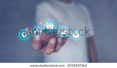 Man holding icon of digital marketing internet and sales increase business technology. Business, E-commerce, Big data analytics, and Business Online.