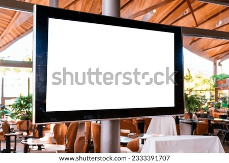Digital Menu board screen display inside a open door restaurant