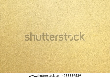 Gold cement wall texture background Royalty-Free Stock Photo #233339539